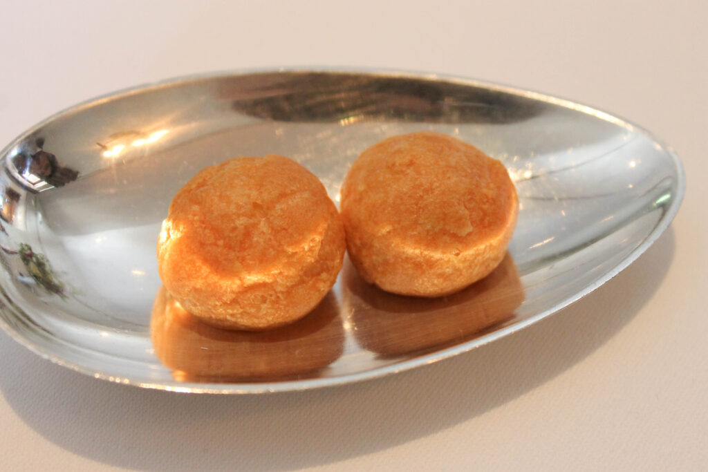 Gruyere cheese puff amuse bouche at The French Laundry