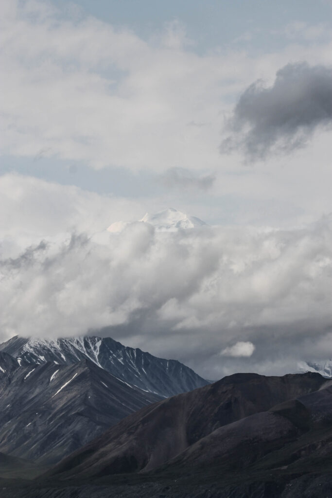 Summit of Mt. Denali visible through the clouds