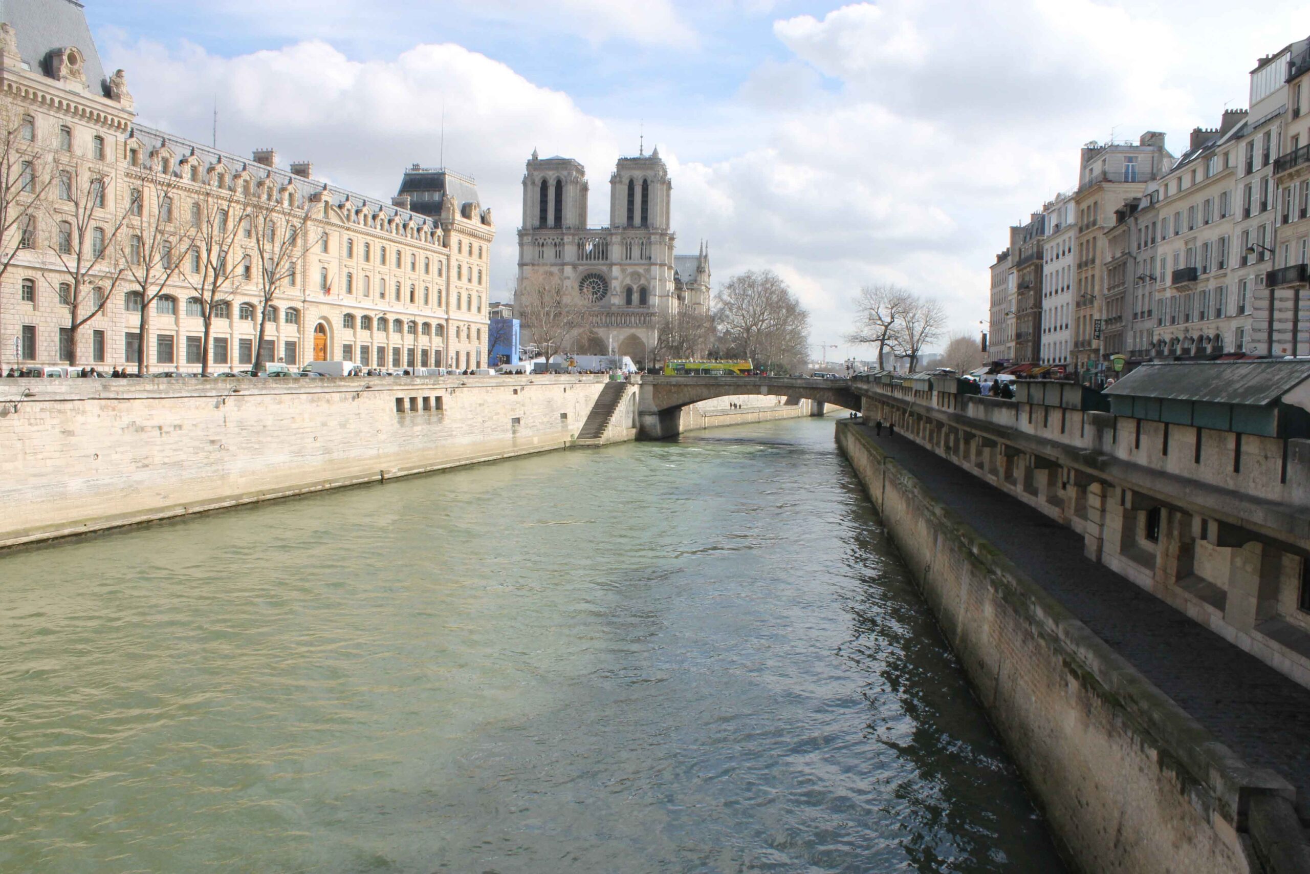 Views of the Seine River, with Notre Dame Cathedral in the background, on a beautiful spring day in Paris