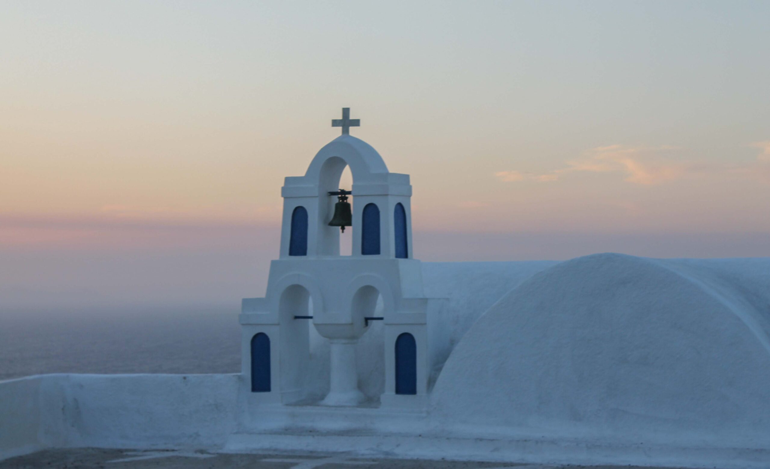 Church bells at sunset in Oia