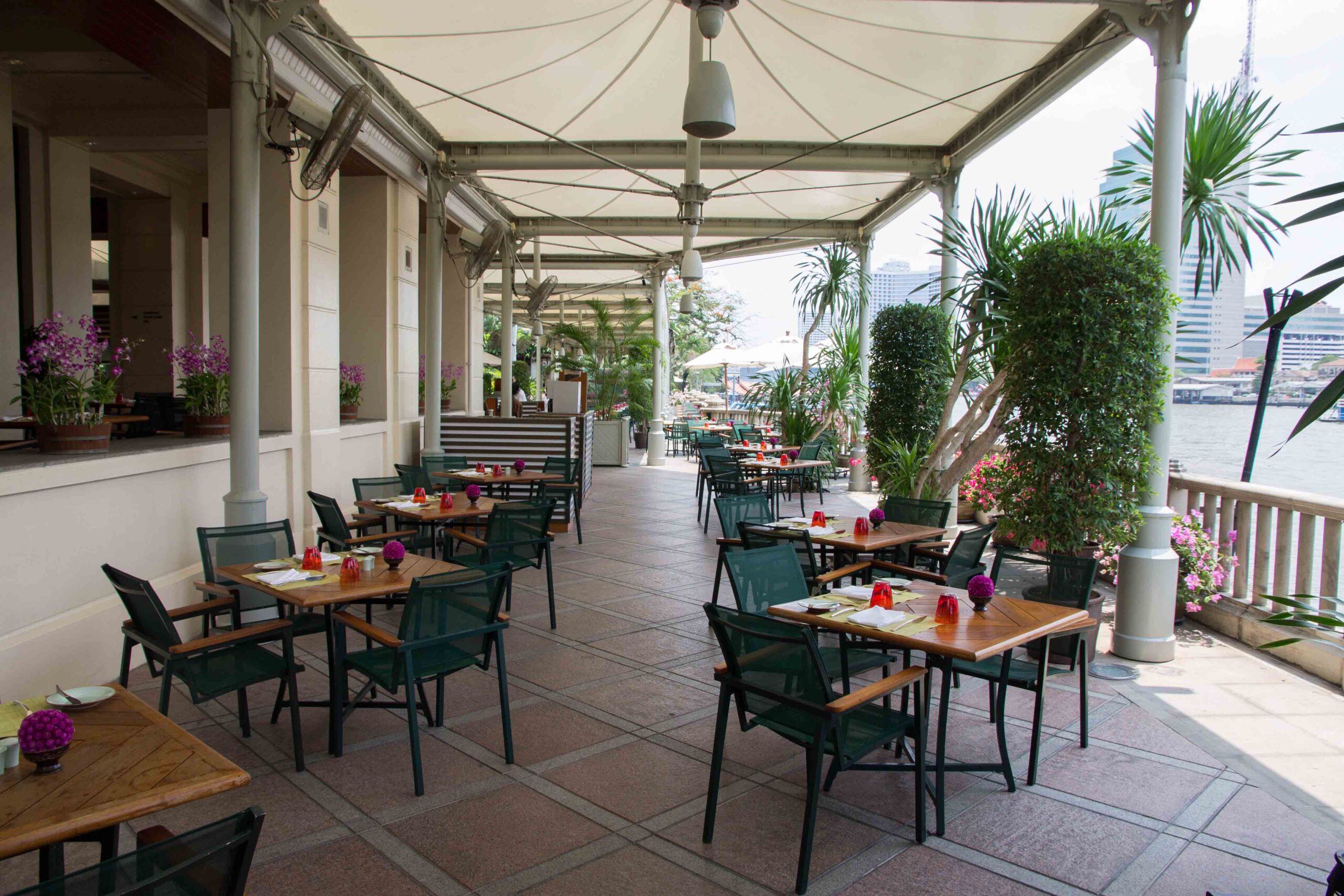 The lovely outdoor seating area for breakfast at The Peninsula Bangkok