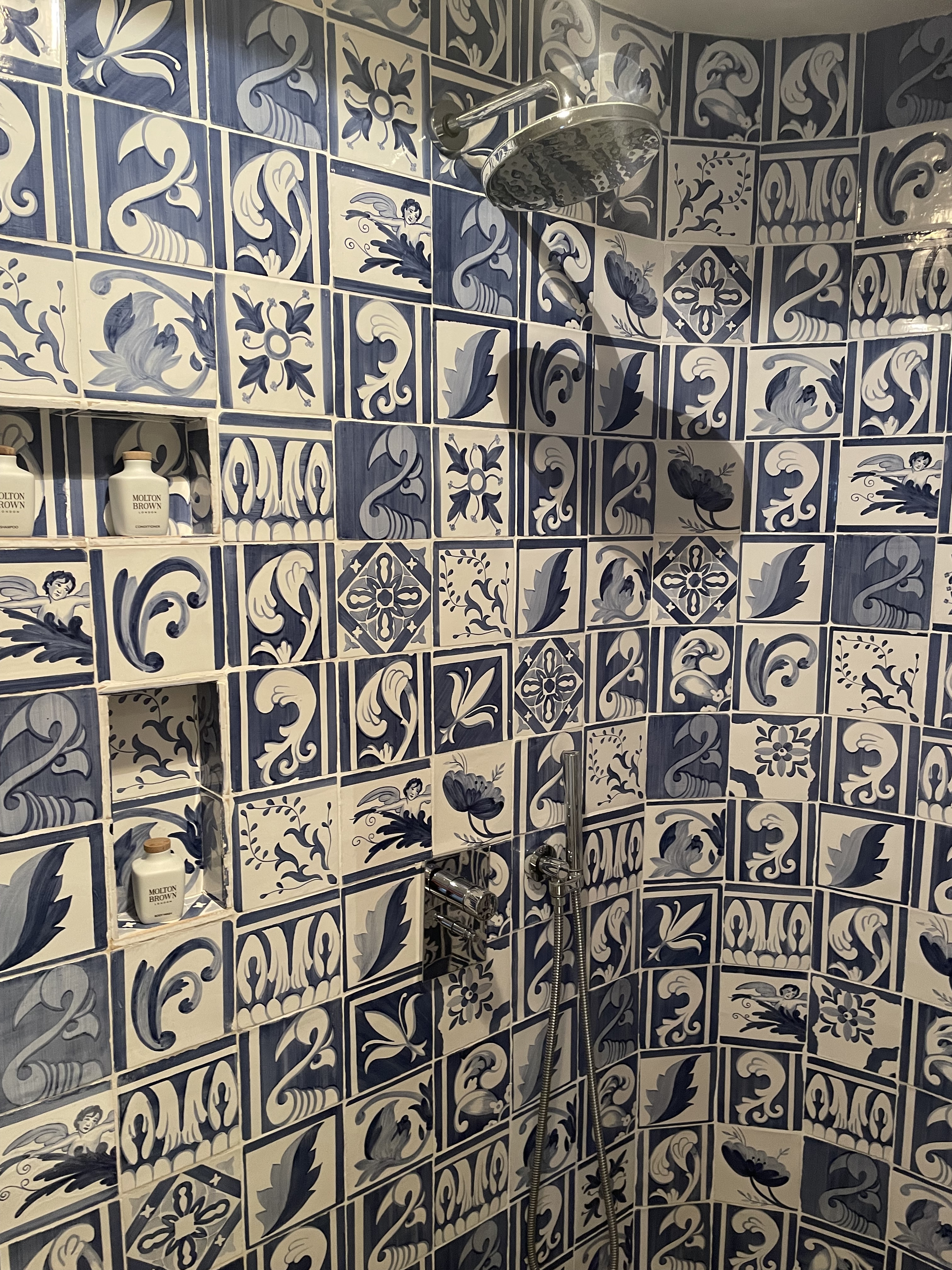 Pretty blue and white tiles in the shower at Hotel Cort