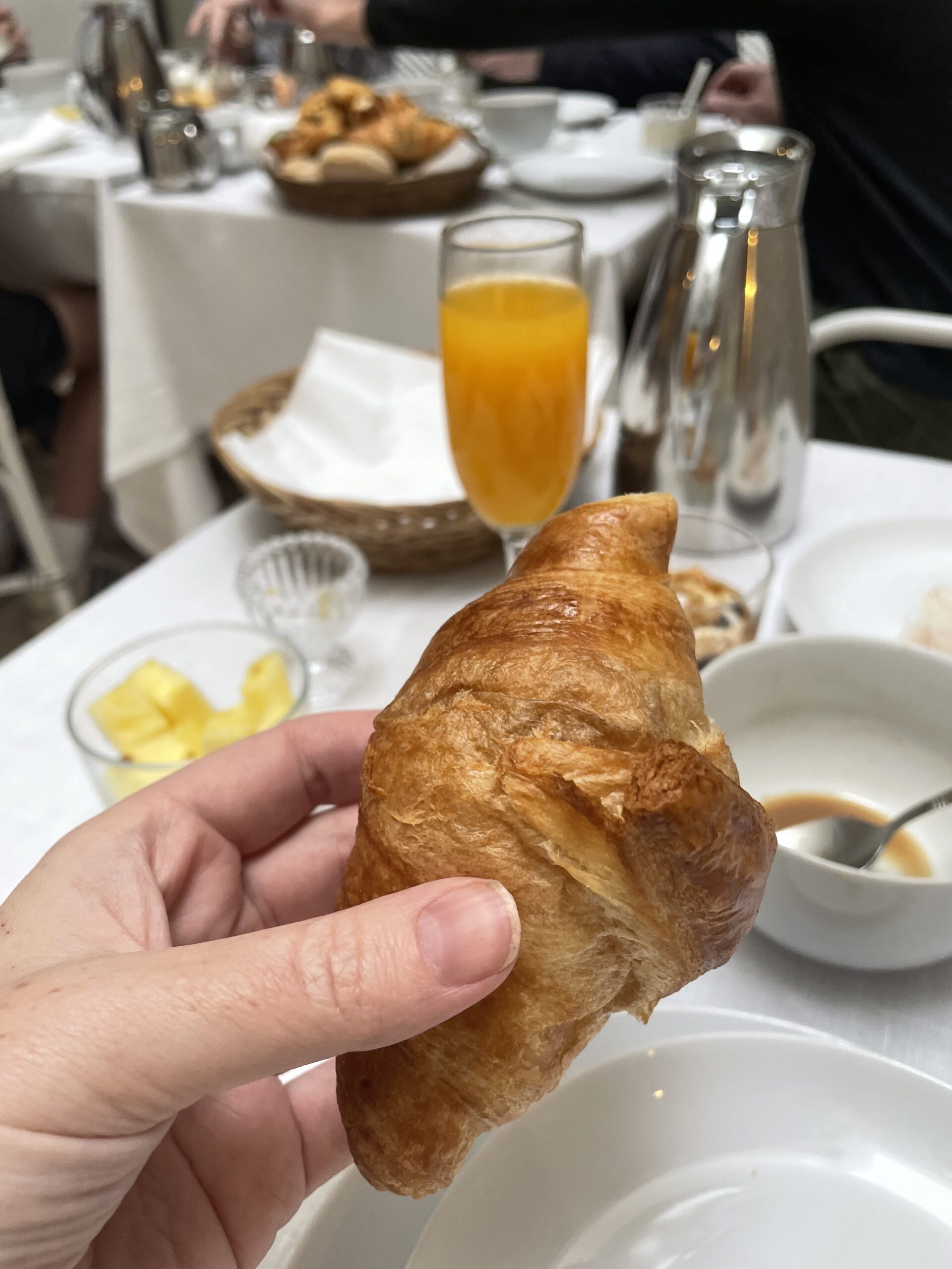 Breakfast at Hotel Amadeus, showing a croissant and freshly-squeezed orange juice
