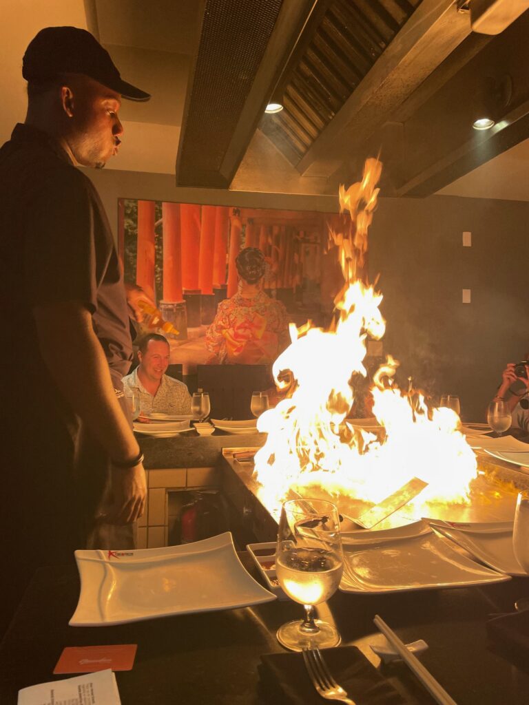 Chef cooking at Kimono's teppanyaki restaurant at Beaches Turks and Caicos