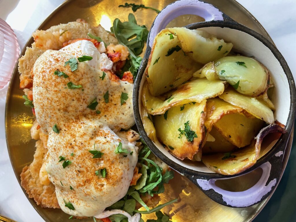 Lobster eggs benedict at Sugar & Scribe, a top brunch spot in La Jolla