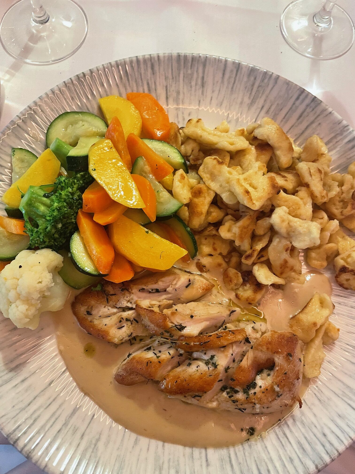 Chicken and cream sauce with spaetzle at Zum Konigstuhl restaurant in Zurich